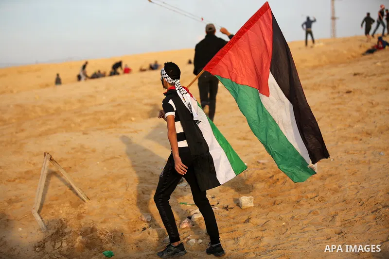 Palestinian protesters gather during clashes with Israeli forces in a demonstration against the Israeli blockade on Gaza Strip, along the Gaza sea barrier on the maritime border with Israel near Kibbutz Zikim, north of B...