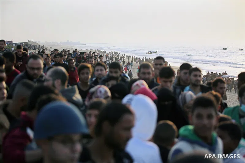 Palestinian protesters gather during clashes with Israeli forces in a demonstration against the Israeli blockade on Gaza Strip, along the Gaza sea barrier on the maritime border with Israel near Kibbutz Zikim, north of B...