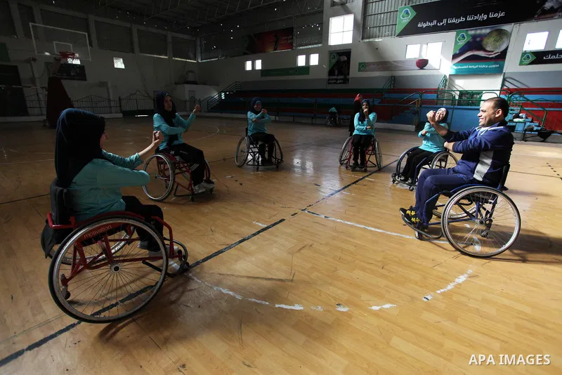 A disabled Palestinian woman on a wheelchair Heda Abu Ouda, 38, takes part in a Karate lesson, at a club in Gaza City on November 27, 2018. Photo by Mahmoud Ajjour