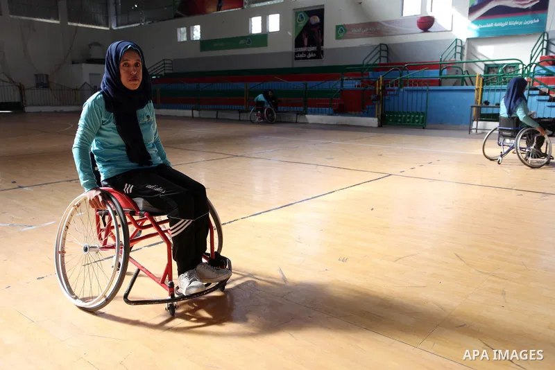 A disabled Palestinian woman on a wheelchair Heda Abu Ouda, 38, takes part in a Karate lesson, at a club in Gaza City on November 27, 2018. Photo by Mahmoud Ajjour