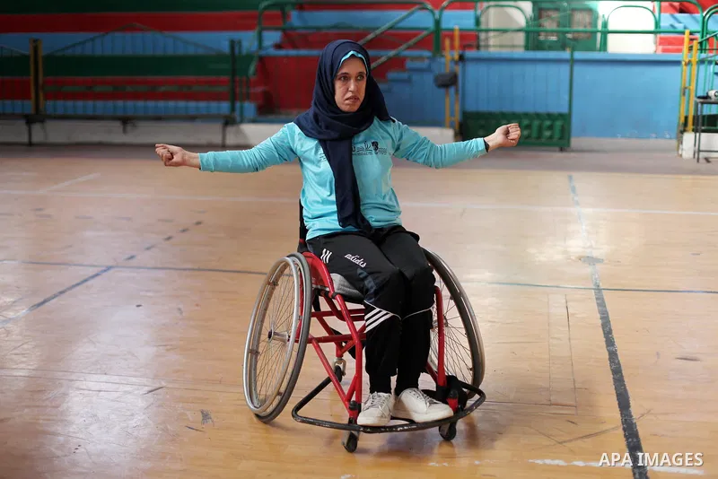 A disabled Palestinian woman on a wheelchair Heda Abu Ouda, 38, takes part in a Karate lesson, at a club in Gaza City on November 27, 2018. Photo by Mahmoud Ajjour