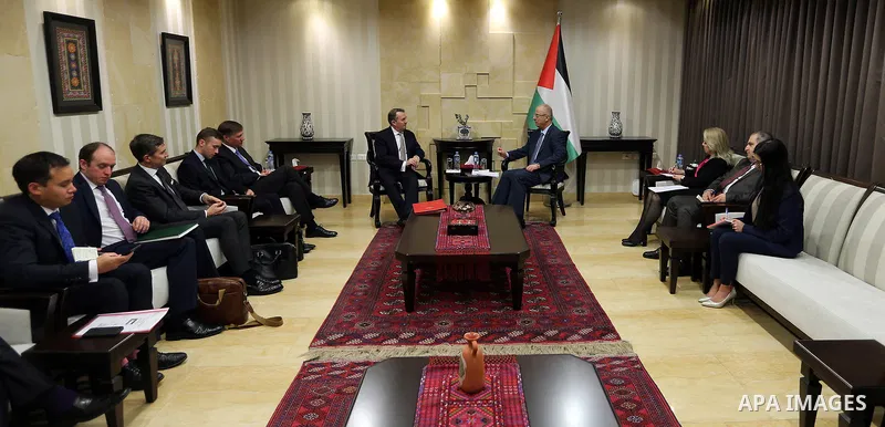 Palestinian Prime Minister Rami Hamdallah meets with Britain's International Trade Secretary Liam Fox, in the West Bank city of Ramallah on November 27, 2018. Photo by Prime Minister Office