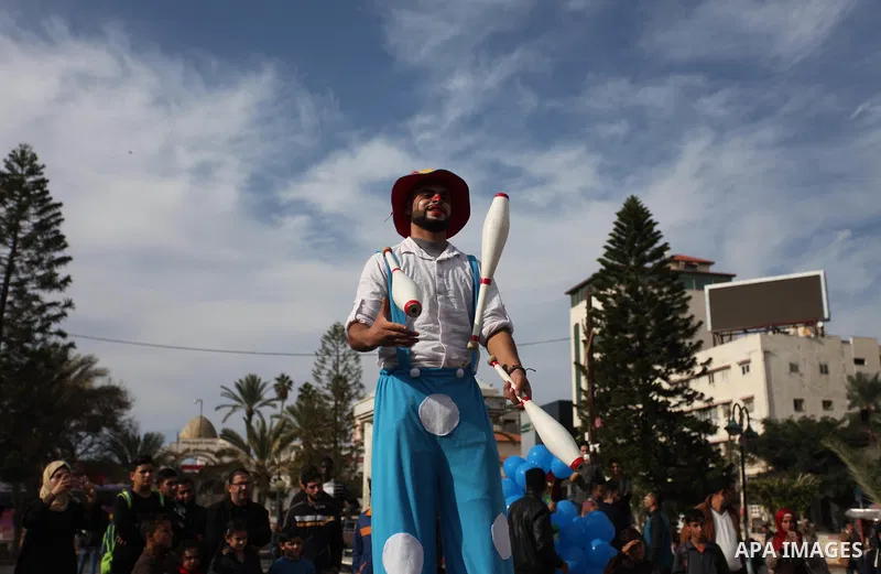 Palestinian clowns perform at street during a street carnival in Gaza city, on November 29, 2018. Photo by Mahmoud Ajjour