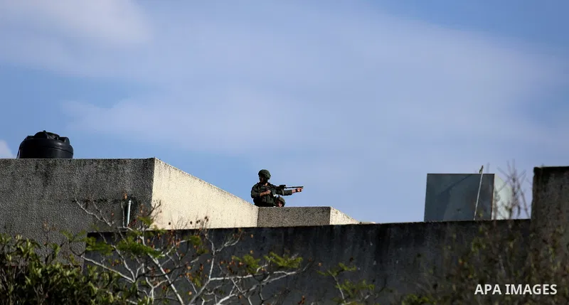 Israeli forces take position during clashes with Palestinian protesters during clashes following a weekly demonstration against the expropriation of Palestinian land by Israel in the village of Kfar Qaddum, near the West...