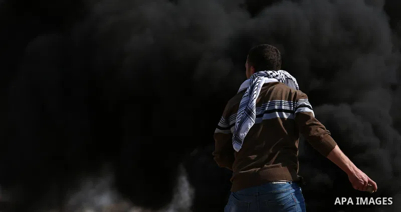 Palestinian protesters hurl stones towards Israeli forces during clashes following a weekly demonstration against the expropriation of Palestinian land by Israel in the village of Kfar Qaddum, near the West Bank city of...
