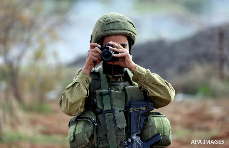 Israeli forces take position during clashes with Palestinian protesters during clashes against Israeli land seizures for Jewish settlements, in the village of al-Mughayyir, near the West Bank city of Ramallah, on Novembe...