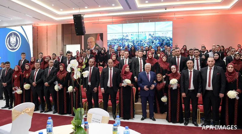 Palestinian President Mahmoud Abbas takes part in mass wedding celebration, in the West Bank city of Ramallah on November 29, 2018. Photo by Thaer Ganaim