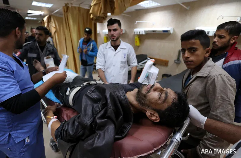 A Palestinian protester who was wounded by Israeli forces during tents protest where Palestinians demand the right to return to their homeland at the Israel-Gaza border, recives treatment at al-Aqsa Hospital in Deir al-B...