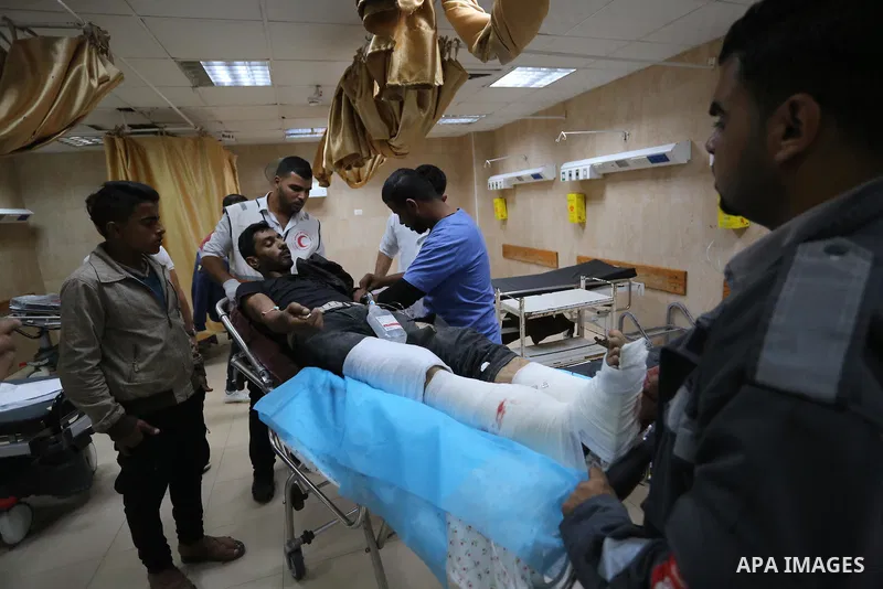 A Palestinian protester who was wounded by Israeli forces during tents protest where Palestinians demand the right to return to their homeland at the Israel-Gaza border, recives treatment at al-Aqsa Hospital in Deir al-B...