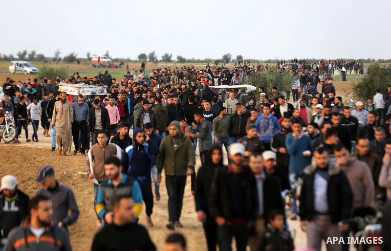 Palestinian protesters gather during tents protest where Palestinians demand the right to return to their homeland at the Israel-Gaza border, in Khan Younis in the southern Gaza Strip on November 30, 2018. Photo by Ashra...