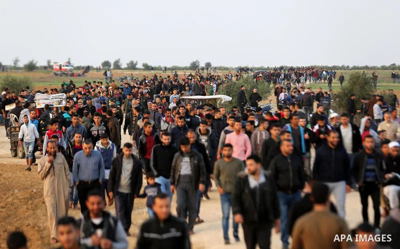 Palestinian protesters gather during tents protest where Palestinians demand the right to return to their homeland at the Israel-Gaza border, in Khan Younis in the southern Gaza Strip on November 30, 2018. Photo by Ashra...