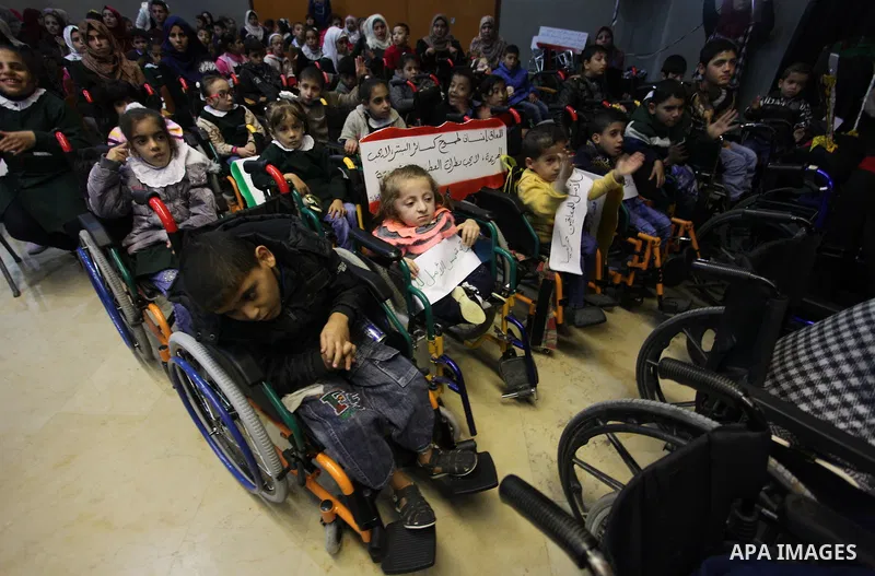 Palestinians and Disabilities attend a ceremony marking the International Day of Persons with Disabilities, organized by the Ministry of Culture in Gaza City on December 3, 2018. Photo by Mahmoud Ajjour