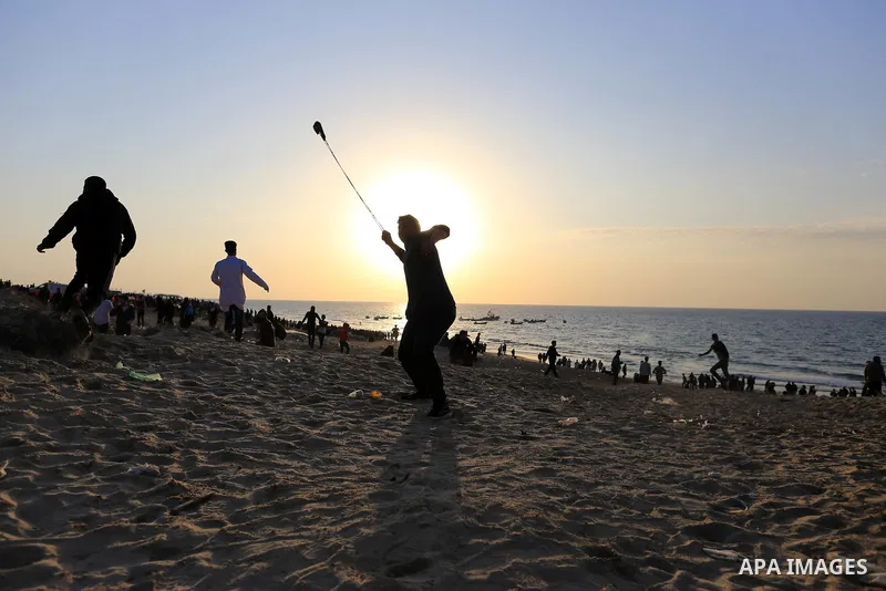Palestinian protesters gather during clashes with Israeli forces in a demonstration against the Israeli blockade on Gaza Strip, along the Gaza sea barrier on the maritime border with Israel near Kibbutz Zikim, north of B...
