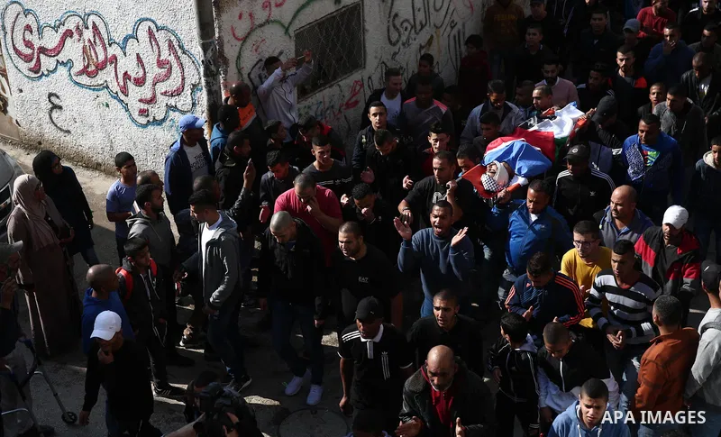 Mourners carry the body of Palestinian Mohammad Habali, 22, who was shot by Israeli forces during his funeral, in the West Bank city of Tulkarem, on December 4, 2018. Habali was shot as Israeli forces raided a western ne...