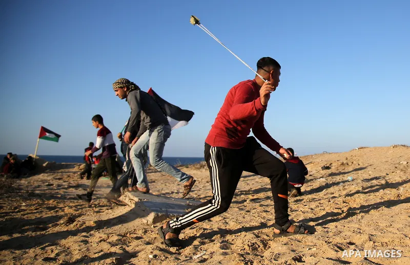 Palestinian protesters gather during clashes with Israeli forces in a demonstration against the Israeli blockade on Gaza Strip, along the Gaza sea barrier on the maritime border with Israel near Kibbutz Zikim, north of B...