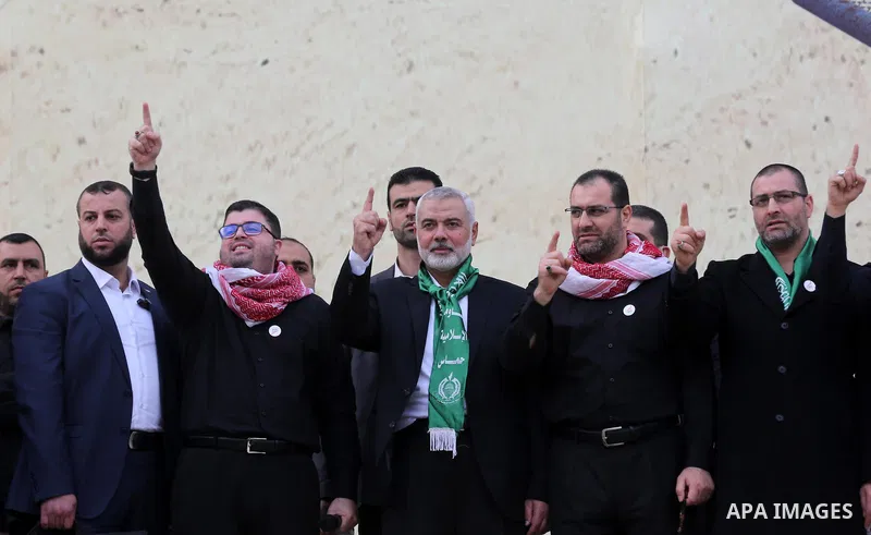 Chairman of the political bureau of the Hamas Palestinian Islamist movement, Ismail Haniyeh waves during a rally marking the 31th anniversary of the founding of the Hamas movement, in Gaza city, December 16, 2018. Photo...