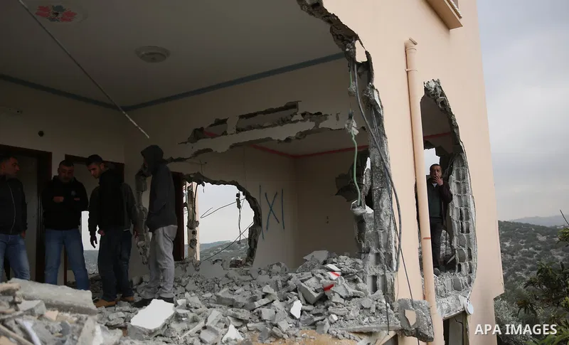 Palestinians inspect the house of Ashraf Naalwa after Israeli forces destroyed it in the village of Shuwaykah, near the West Bank city of Tulkarem, on December 17, 2018. Ashraf Naalwa was killed on December 12 by Israeli...