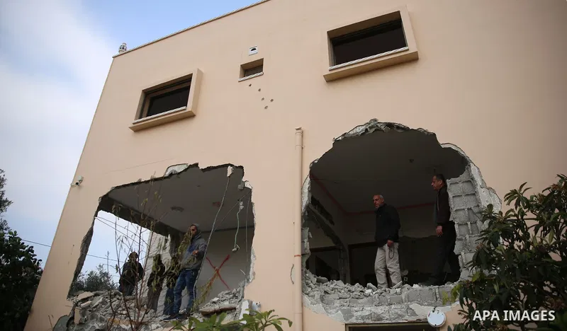 Palestinians inspect the house of Ashraf Naalwa after Israeli forces destroyed it in the village of Shuwaykah, near the West Bank city of Tulkarem, on December 17, 2018. Ashraf Naalwa was killed on December 12 by Israeli...