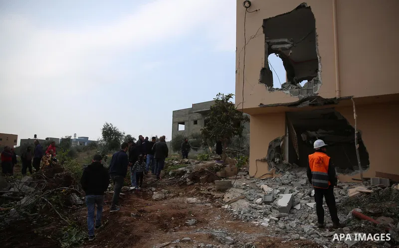 Palestinians inspect the house of Ashraf Naalwa after Israeli forces destroyed it in the village of Shuwaykah, near the West Bank city of Tulkarem, on December 17, 2018. Ashraf Naalwa was killed on December 12 by Israeli...