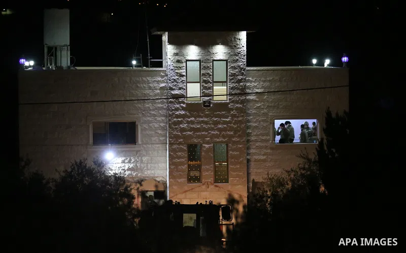 An excavator of the Israeli forces destroys the house of Palestinian man Ashraf Naalwa in the village of Shuwaykah, near the West Bank city of Tulkarem, on December 17, 2018. - Ashraf Naalwa was killed on December 12 by...