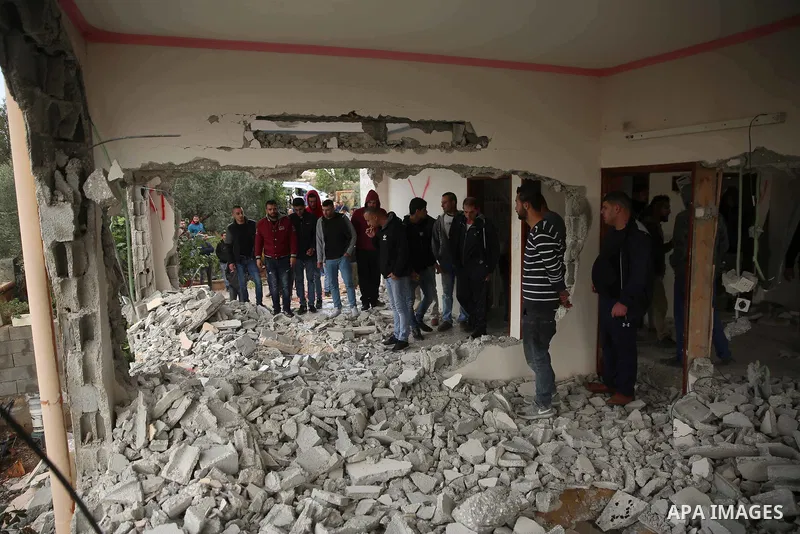 Palestinians inspect the house of Ashraf Naalwa after Israeli forces destroyed it in the village of Shuwaykah, near the West Bank city of Tulkarem, on December 17, 2018. Ashraf Naalwa was killed on December 12 by Israeli...