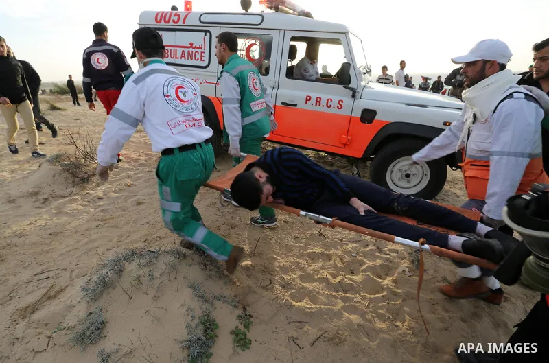 Palestinian protesters gather during clashes with Israeli forces in a demonstration against the Israeli blockade on Gaza Strip, along the Gaza sea barrier on the maritime border with Israel near Kibbutz Zikim, north of B...