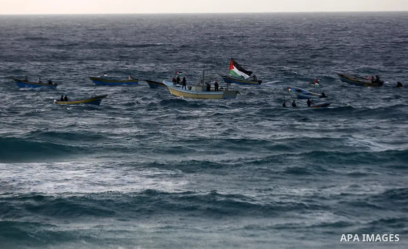 Palestinian protesters gather during clashes with Israeli forces in a demonstration against the Israeli blockade on Gaza Strip, along the Gaza sea barrier on the maritime border with Israel near Kibbutz Zikim, north of B...