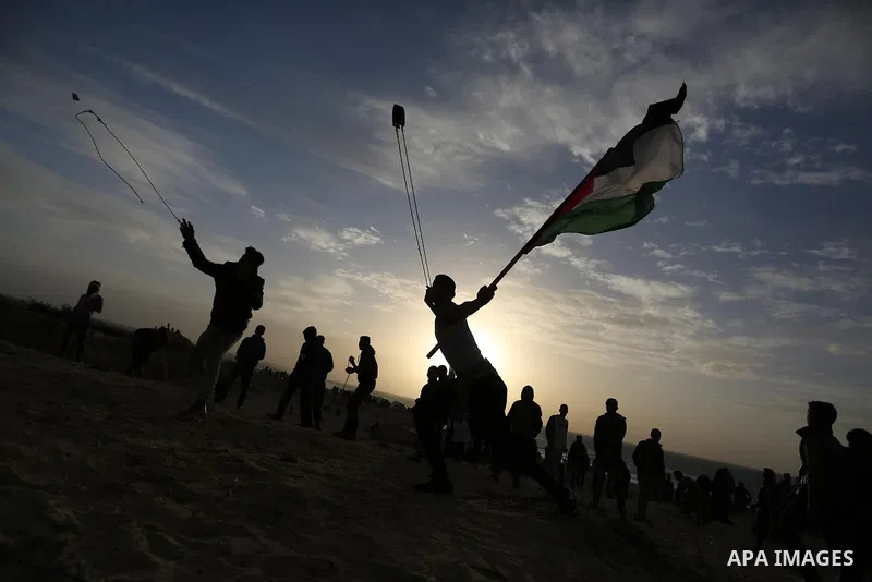 Palestinian protesters gather during clashes with Israeli forces in a demonstration against the Israeli blockade on Gaza Strip, along the Gaza sea barrier on the maritime border with Israel near Kibbutz Zikim, north of B...