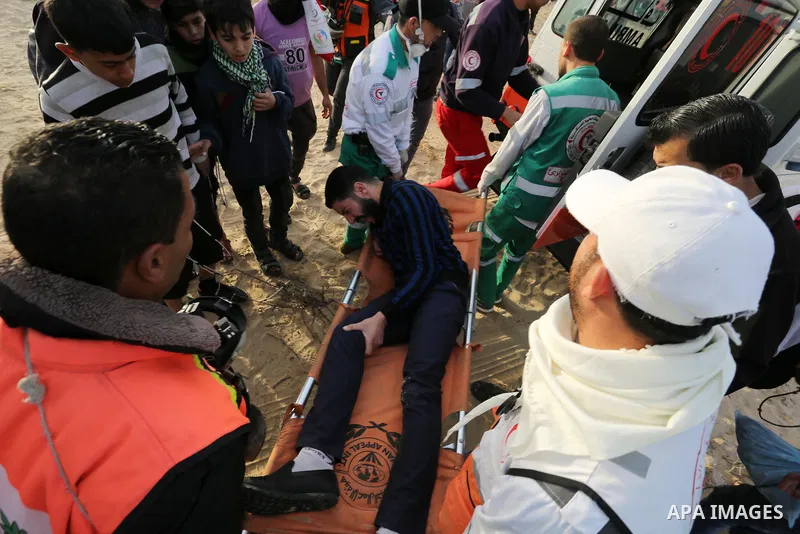 Palestinian protesters gather during clashes with Israeli forces in a demonstration against the Israeli blockade on Gaza Strip, along the Gaza sea barrier on the maritime border with Israel near Kibbutz Zikim, north of B...