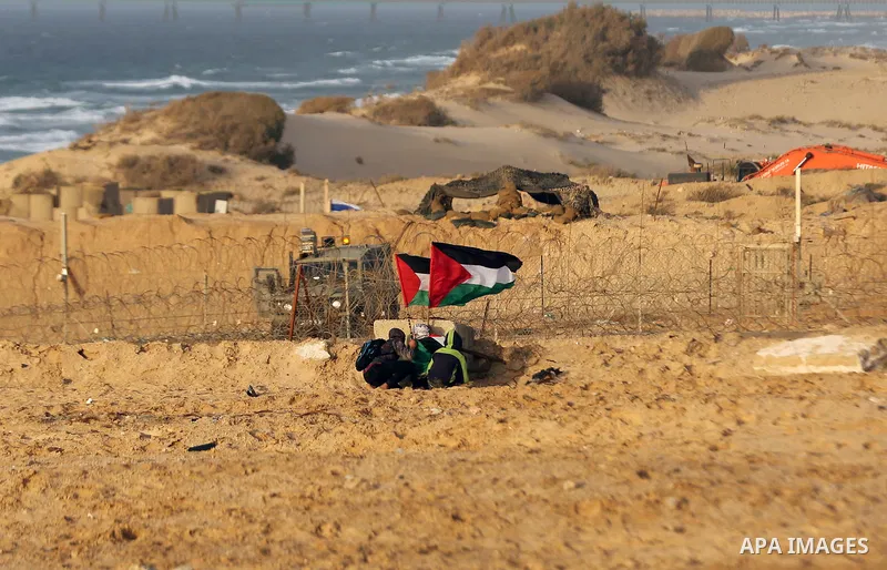 Palestinian protesters gather during clashes with Israeli forces in a demonstration against the Israeli blockade on Gaza Strip, along the Gaza sea barrier on the maritime border with Israel near Kibbutz Zikim, north of B...