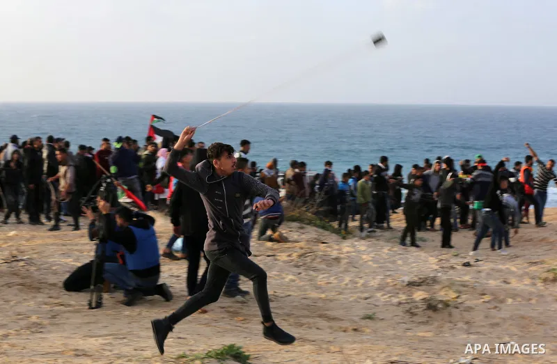 Palestinian protesters gather during clashes with Israeli forces in a demonstration against the Israeli blockade on Gaza Strip, along the Gaza sea barrier on the maritime border with Israel near Kibbutz Zikim, north of B...