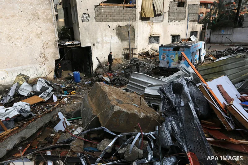 A Palestinian man walks on the rubbles of Al-Aqsa channel belonging to Hamas movement, that was destroyed by Israeli air forces in Gaza City, Gaza Strip, December 20, 2018. A Hamas-affiliated TV station which had its stu...