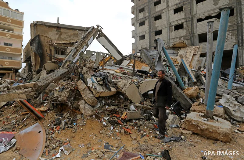A Palestinian man walks on the rubbles of Al-Aqsa channel belonging to Hamas movement, that was destroyed by Israeli air forces in Gaza City, Gaza Strip, December 20, 2018. A Hamas-affiliated TV station which had its stu...