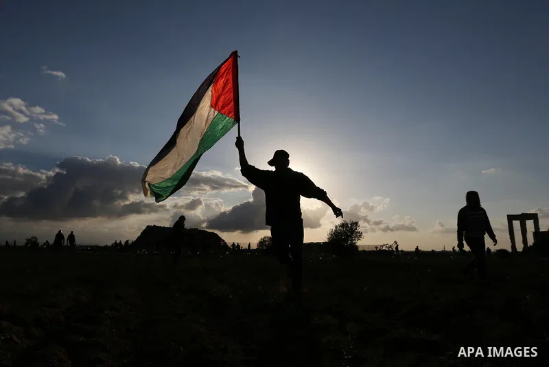 Palestinian protesters gather during clashes with Israeli troops in tents protest where Palestinians demand the right to return to their homeland at the Israel-Gaza border, in Khan Younis in the southern Gaza Strip on De...