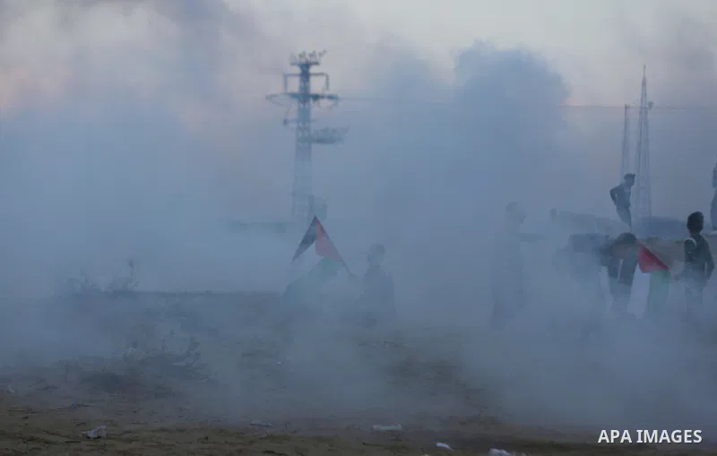 Palestinian protesters gather during clashes with Israeli forces in a demonstration against the Israeli blockade on Gaza Strip, along the Gaza sea barrier on the maritime border with Israel near Kibbutz Zikim, north of B...