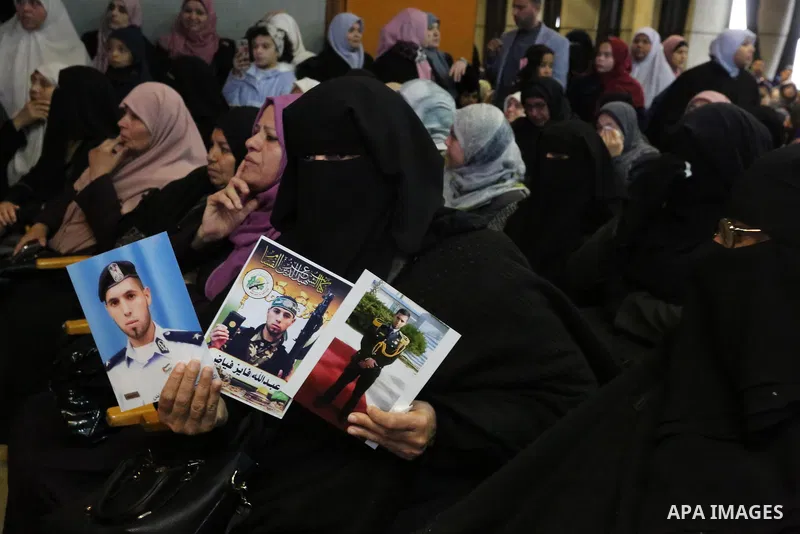 Palestinians attend the celebration of the National Day of Martyrs of the Ministry of Interior and National Security marking the 10th anniversary of the Israel-Gaza war, in Gaza City, on December 27, 2018. Photo by Ashra...