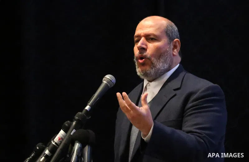 Senior Hamas leader Khalil al-Hayah speaks during the celebration of the National Day of Martyrs of the Ministry of Interior and National Security marking the 10th anniversary of the Israel-Gaza war, in Gaza City, on Dec...