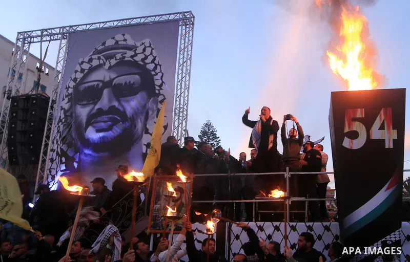 Palestinian supporters of the Fatah movement take part during a rally marking the fifty-four anniversary of the creation of the political party, in Gaza city on December 31, 2018. Photo by Mahmoud Khattab