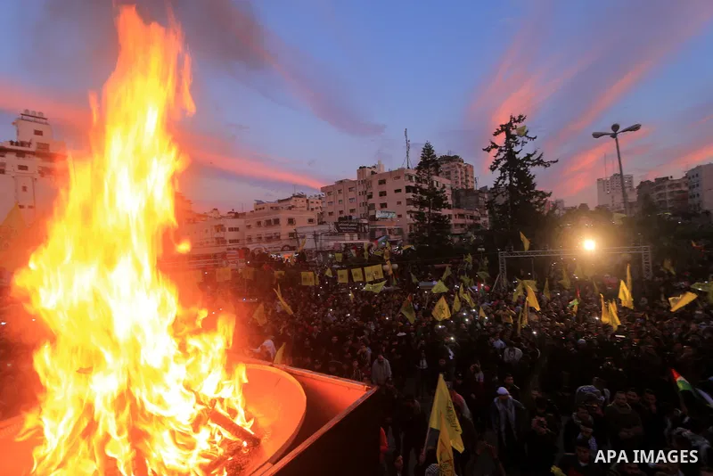 Palestinian supporters of the Fatah movement take part during a rally marking the fifty-four anniversary of the creation of the political party, in Gaza city on December 31, 2018. Photo by Mahmoud Khattab