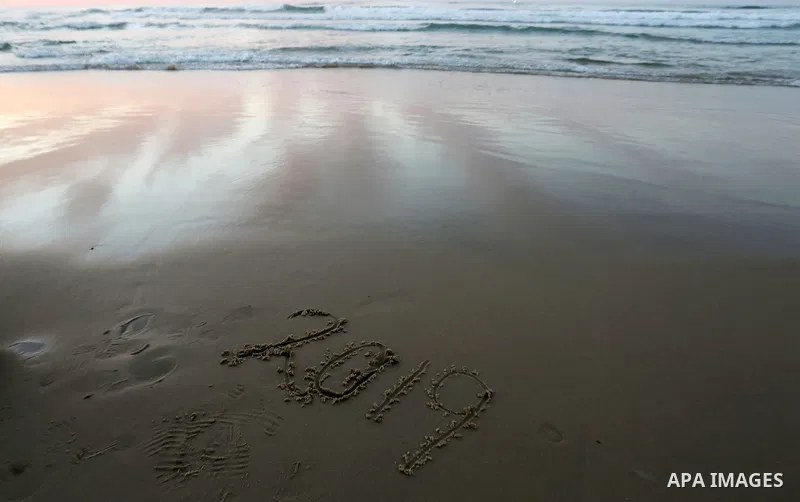 Palestinians enjoy their time on the beach during sunset in the last day of 2018, a few hours prior to the new year's celebrations, in Gaza city on December 31, 2018. Photo by Ashraf Amra
