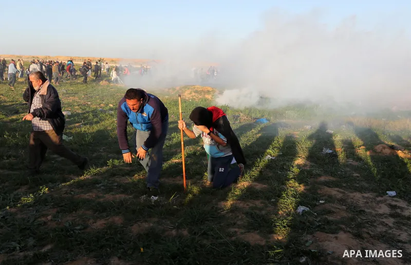 Palestinian protesters gather during clashes with Israeli troops in tents protest where Palestinians demand the right to return to their homeland at the Israel-Gaza border, in Khan Younis in the southern Gaza Strip on Ja...