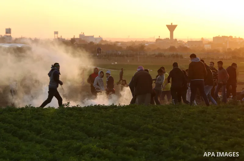 Palestinian protesters gather during clashes with Israeli troops in tents protest where Palestinians demand the right to return to their homeland at the Israel-Gaza border, in Khan Younis in the southern Gaza Strip on Ja...