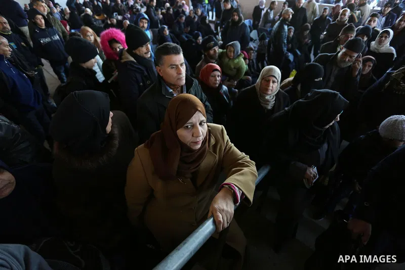 Palestinians wait for travel permits to cross into Egypt through the Rafah border crossing in Rafah in the southern of Gaza Strip on January 29, 2019. The crossing is the only way for Palestinians to leave Gaza that bypa...