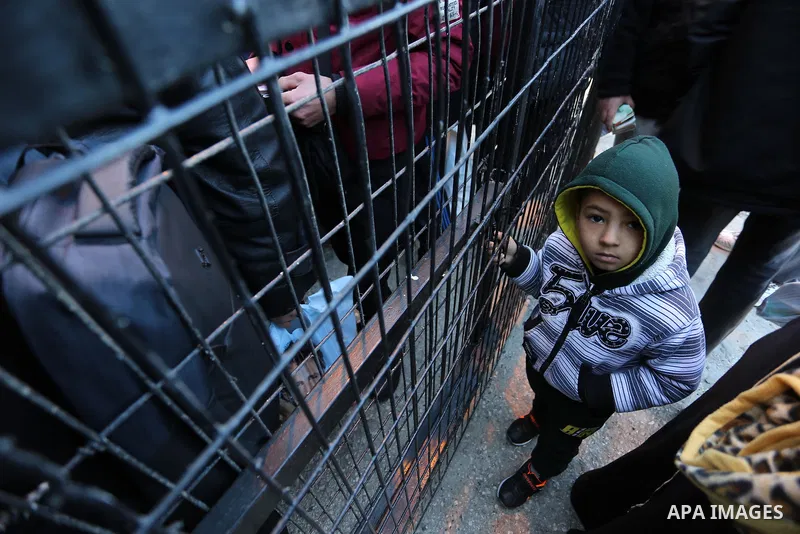 Palestinians wait for travel permits to cross into Egypt through the Rafah border crossing in Rafah in the southern of Gaza Strip on January 29, 2019. The crossing is the only way for Palestinians to leave Gaza that bypa...