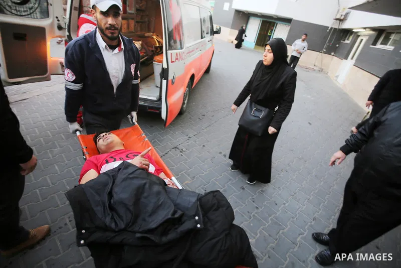 A Palestinian youth who was wounded by Israeli tropps during clashes in a demonstration against the Israeli blockade on Gaza Strip, along the Gaza sea barrier on the maritime border with Israel near Kibbutz Zikim, is whe...