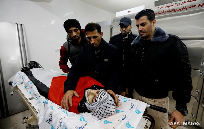 Palestinian relatives of Riyad Shamasneh mourn over his body at hospital morgue, in the West Bank city of Ramallah, January 299, 2019. Shamasneh, 28, from the village of Qattanah, was killed early Saturday morning in eas...