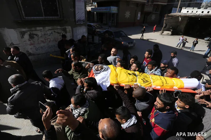 Mourners carry the body of Palestinian Samir al-Nabaheen 47, who was died of his wounds which he sustained by Israeli forces during clashes in tents protest where Palestinians demand the right to return to their homeland...