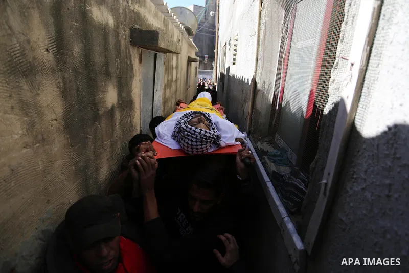 Mourners carry the body of Palestinian Samir al-Nabaheen 47, who was died of his wounds which he sustained by Israeli forces during clashes in tents protest where Palestinians demand the right to return to their homeland...