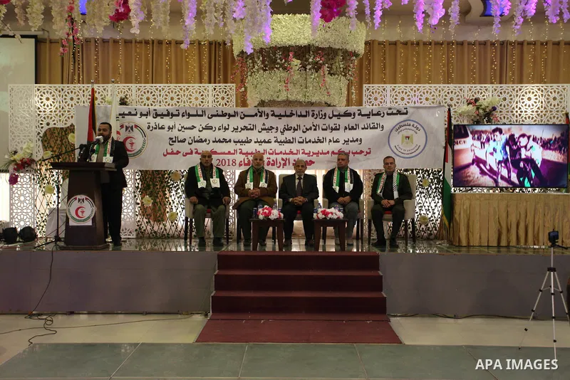 Senior Hamas leader Mahmoud al-Zahar, and Tawfiq Abu Naim, Palestinian director general of the internal security forces, attend a ceremony organized by the Directorate of Military Medical Services, in Gaza City on Januar...