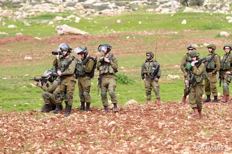 Israeli security forces take position during clashes with Palestinian protesters in al-Mughayar village, near the West Bank city of Ramallah, February 01, 2019. Photo by Ahmad Arouri